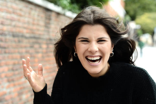 istock Young woman laughing 1044855022