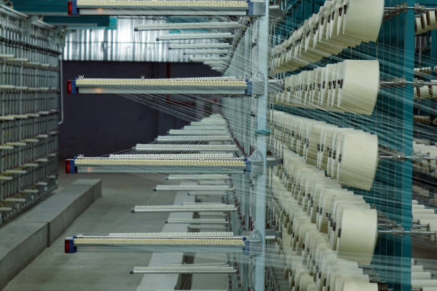 istock Industrial textile factory. Coils with threads in production.Fabric production . 1044856444