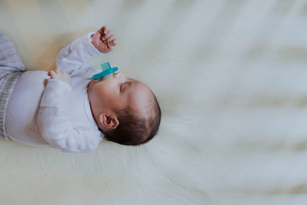 istock Peaceful baby sleeping in a crib 1044857662