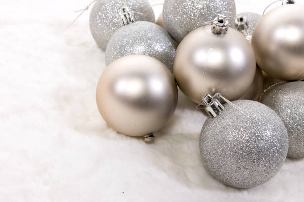 istock Christmas baubles on white fur background 1044859732