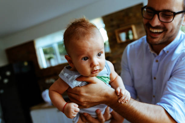 istock Father playing with his baby 1044870586