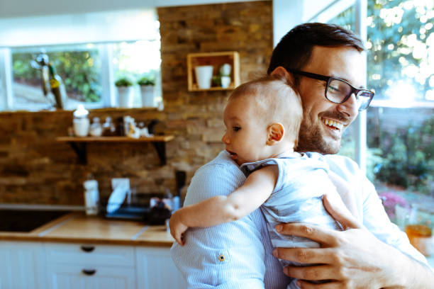 istock Father playing with his baby 1044870588