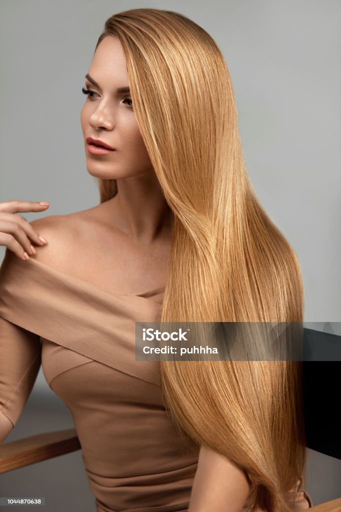 Long Blonde Hair. Beautiful Woman With Healthy Straight Hair Long Blonde Hair. Beautiful Woman With Healthy Straight Hair. Girl With Natural Glossy Blond Hair. High Resolution Hair Stock Photo