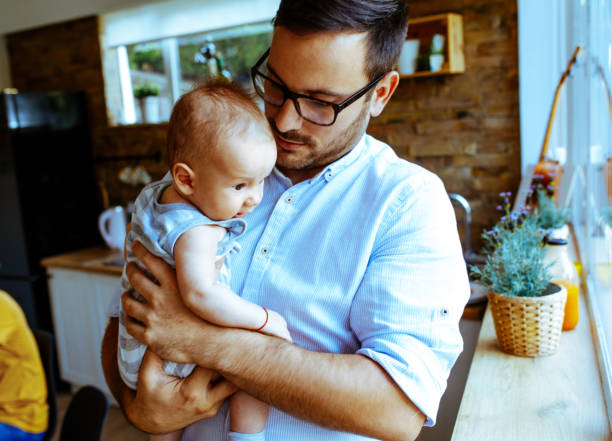 istock Father playing with his baby 1044870676