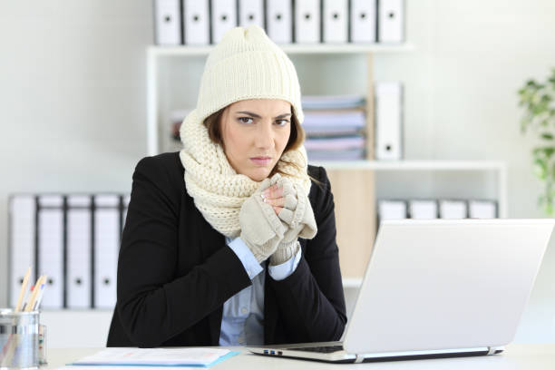 istock Angry businesswoman having cold at office 1044874300