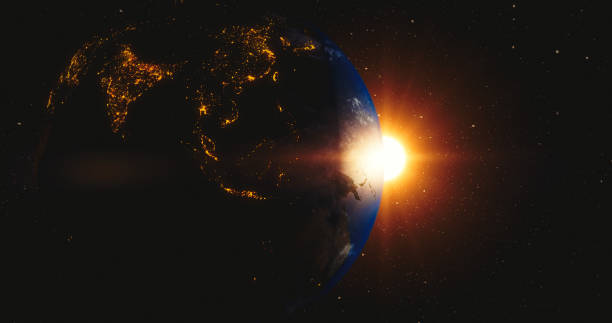 istock Rising sun behind planet earth 1044875874