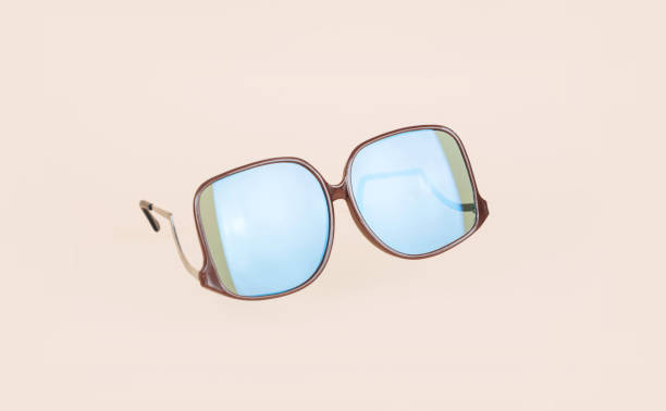 istock Retro sunglasses on minimal bright background. Summer concept. 1044879676