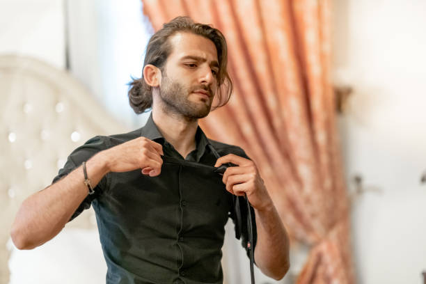 istock Frustration and Stress, untying necktie 1044879786