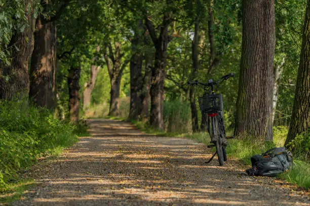 Bicycle on path near south Bohemia ponds with backpack
