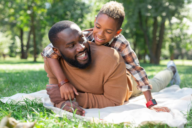 istock Delighted nice father and son resting together in the park 1044900560