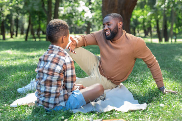 istock Positive joyful man speaking with his son 1044900602
