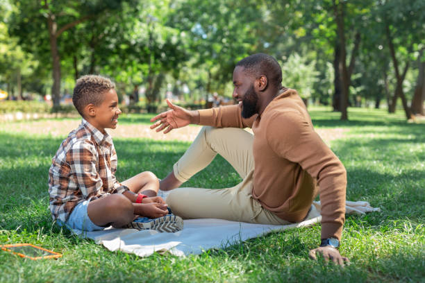 istock Happy cute son listening to his dad 1044900604