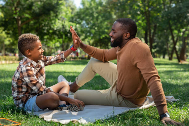 istock Delighted happy father and son giving high five 1044900616