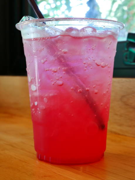 Red water with ice in a cup