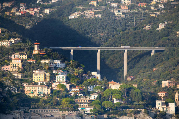 Large road bridge spanning a ravine near the beautiful coastline of Italy near the town of Santa Margherita Large road bridge spanning a ravine near the beautiful coastline of Italy near the town of Santa Margherita santa margherita ligure italy stock pictures, royalty-free photos & images