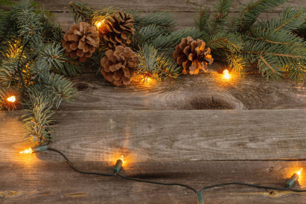 istock Christmas fir branches with cones and garland 1044904876