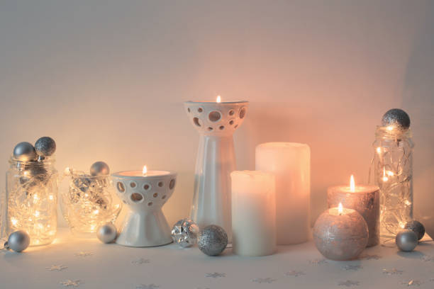 istock Christmas decoration with candles on background  white wall 1044904878