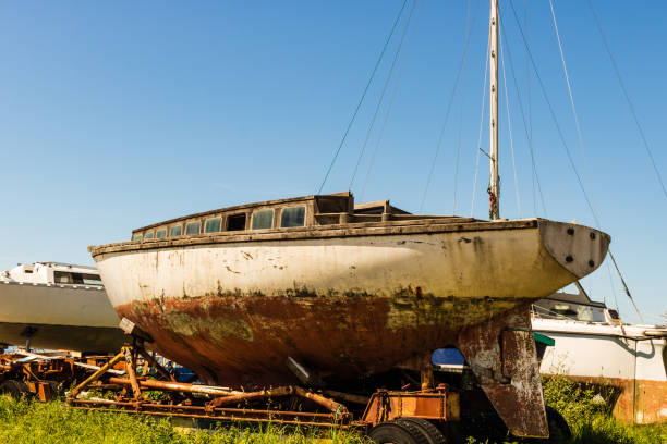 istock Cherbourg, France - 2018. Old rusty boat waiting for dry dock. 1044905206