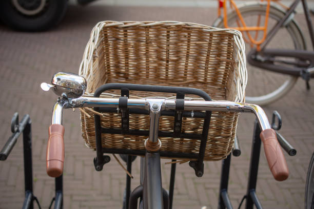 Robust bicycle basket and bell on steer Robust bicycle with large basket and bell bicycle basket stock pictures, royalty-free photos & images