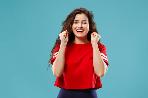 istock Winning success woman happy ecstatic celebrating being a winner. Dynamic energetic image of female model 1044907938