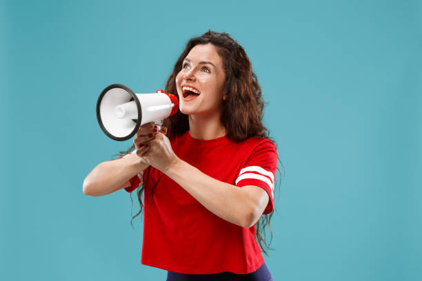 istock Woman making announcement with megaphone 1044908066