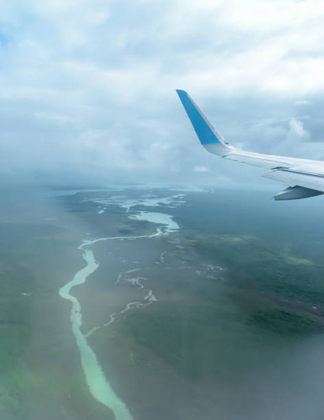 istock Aerial view of a river, clouds and blue sky 1044908106