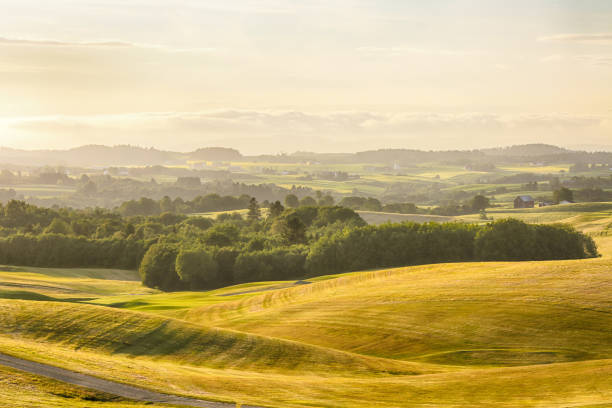 Fall in Norway, the view of the hills and farms in the agricultural area Byneset located near the Norwegian city Trondheim
