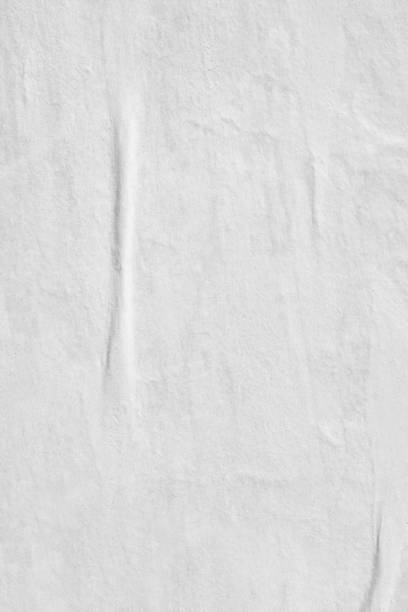 istock Blank white old ripped torn paper crumpled creased posters grunge textures backdrop backgrounds placard 1044908878