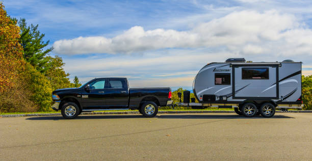 Truck & RV trailer Jonas Ridge, NC, USA-16 October 17:  A Ram 2500 pickup towing a Camplite 16DBS travel trailer at an overlook on the Blue Ridge Parkway. blue ridge parkway photos stock pictures, royalty-free photos & images