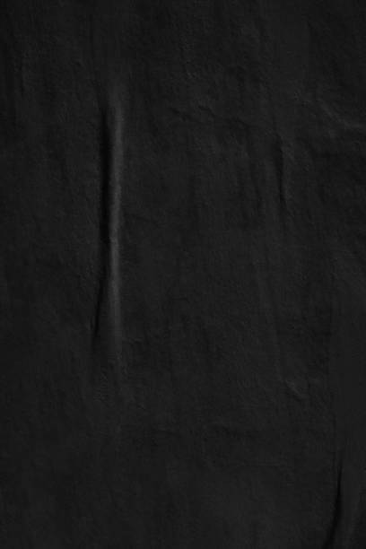 istock Dark black blank paper backgrounds creased crumpled surface old torn ripped posters grunge textures placard 1044912158