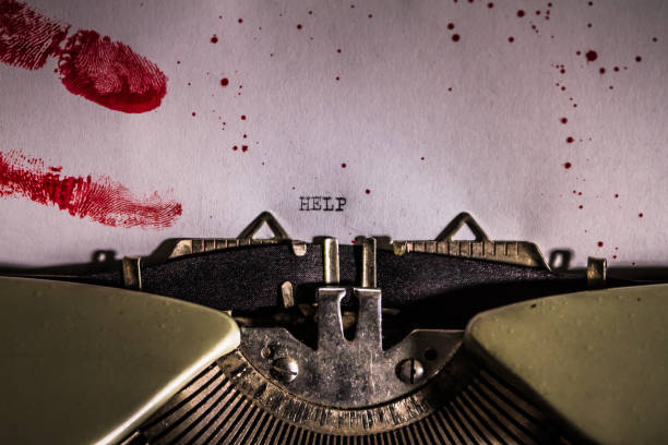 The word help typed on paper with blood stains and bloody fingerprints The word help typed on paper with blood stains and bloody fingerprints serial killings photos stock pictures, royalty-free photos & images