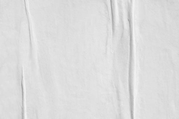 istock Blank white old ripped torn paper crumpled creased posters grunge textures backdrop backgrounds placard 1044913452