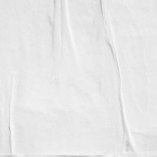 istock Blank white old ripped torn paper crumpled creased posters grunge textures backdrop backgrounds placard 1044915630