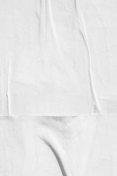 istock Blank white old ripped torn paper crumpled creased posters grunge textures backdrop backgrounds placard 1044915860