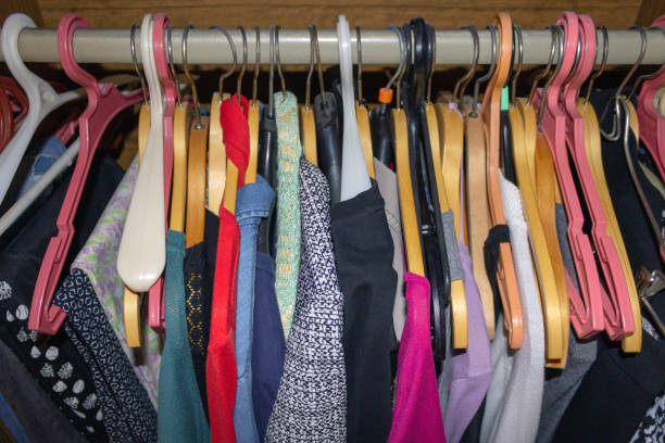 istock Clothes hanging on hangers in the closet 1044922518