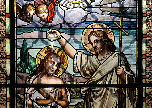 Colorful mosaic glass art of the Baptism of Jesus