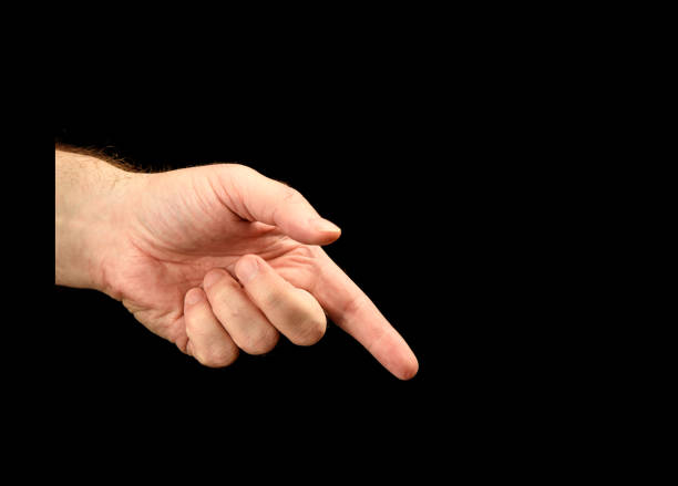 istock Left male hand with index finger shows direction 1044934418