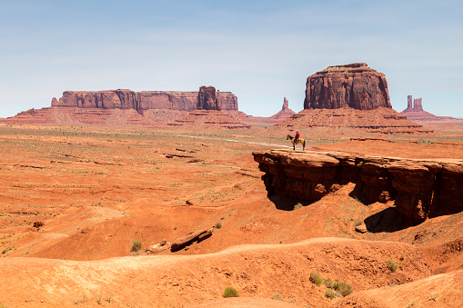 Navaho Indian on horse at John Ford's Point in Monument Valley, Arizona, USA.