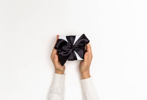 istock Woman holding a gift box 1044935808