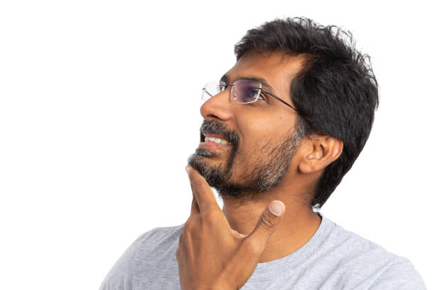 istock Male thinking and looking up wearing goggles or eyeglasses 1044938928