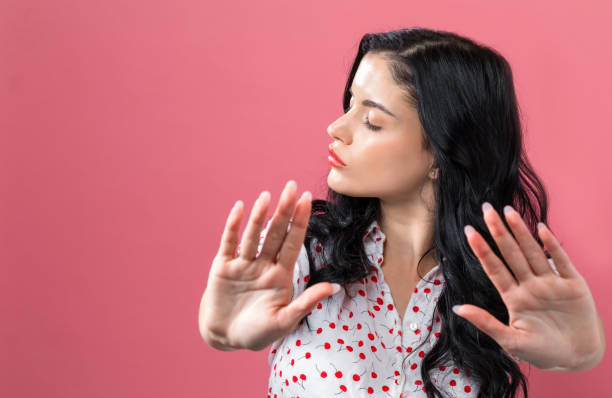 Young woman making a rejection pose stock photo