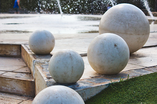 Giant white marble spheres on a modern design fountain