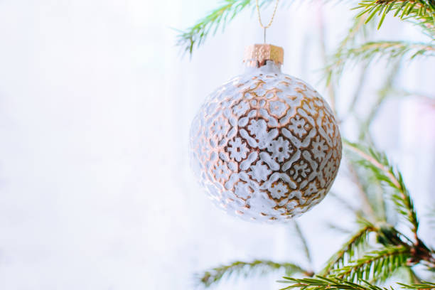 istock Holiday border with hanging gold ball 1044942736