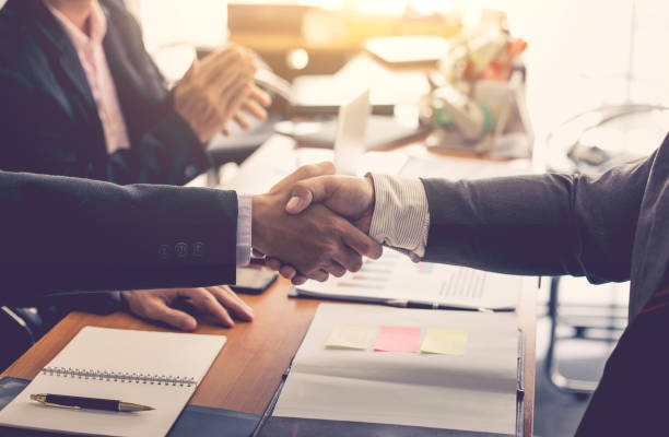 istock Businessman shaking hands discussing a contract agreement. 1044943038