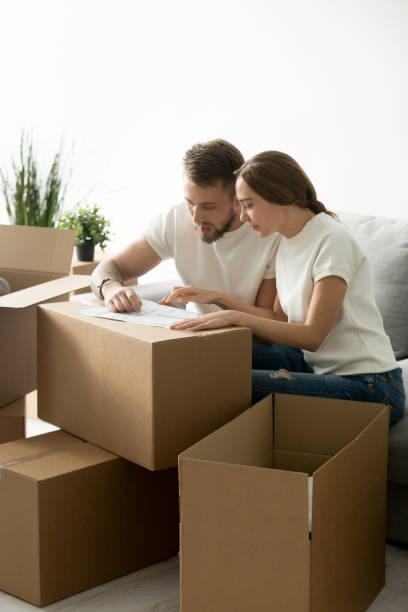 istock Serious couple discussing house blueprint considering interior design 1044943302