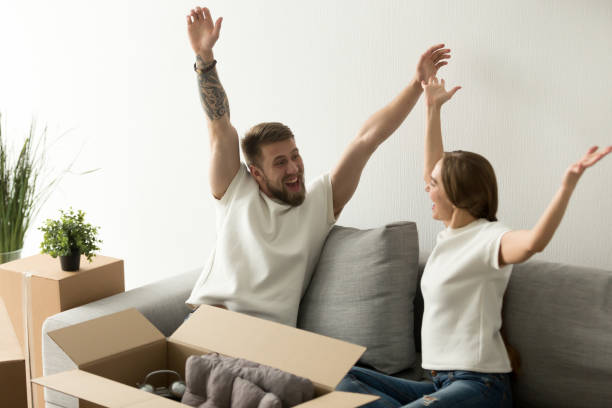 istock Happy millennial couple celebrating moving in together 1044943320
