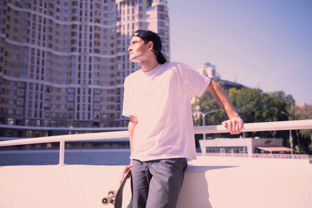 Attentive male person looking upwards on sky