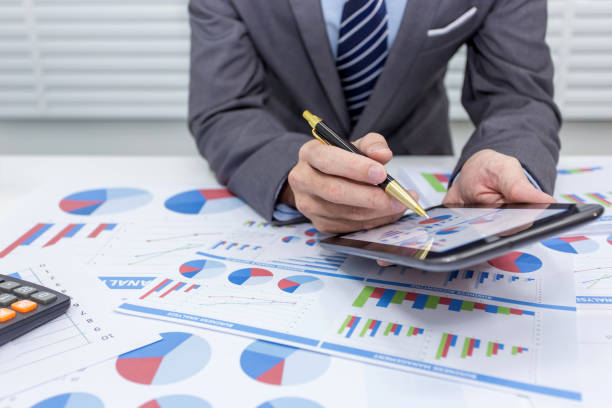 istock Business people using tablet at working with financial. 1044944082