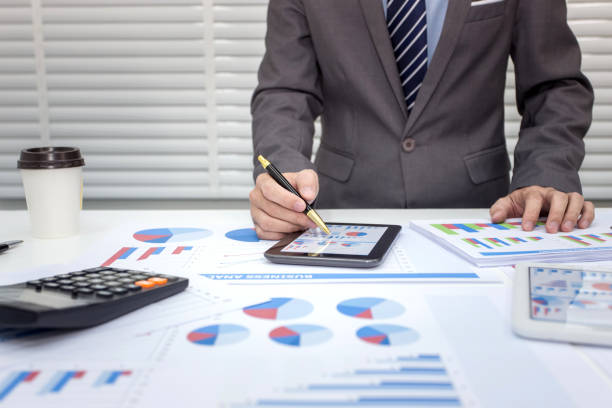 istock Business people using tablet at working with financial. 1044944086
