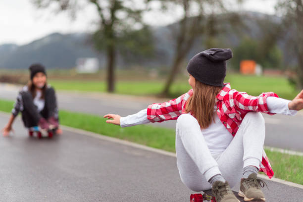 istock Two little girls on skateboards 1044946320